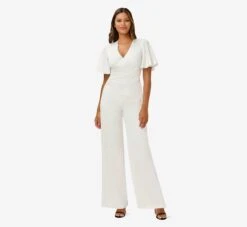 Adrianna Papell Satin Crepe Faux Wrap Jumpsuit With Flutter Sleeves In Ivory