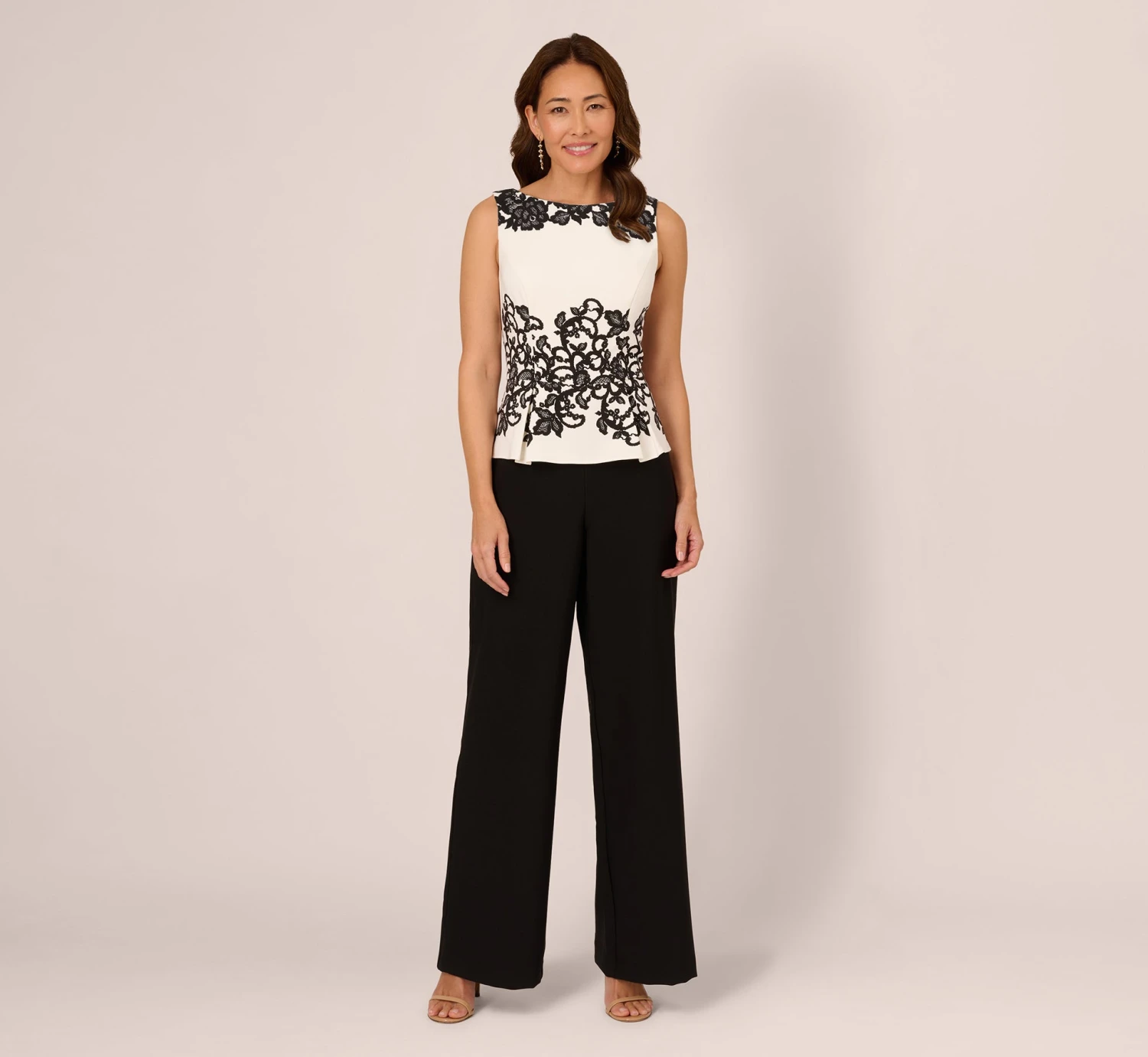 Adrianna Papell Sleeveless Peplum Jumpsuit With Scroll Lace Details In Ivory Black 1 Adrianna Papell Sleeveless Peplum Jumpsuit With Scroll Lace Details In Ivory Black