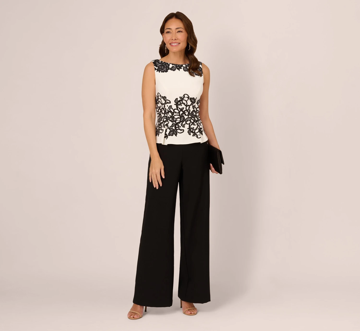 Adrianna Papell Sleeveless Peplum Jumpsuit With Scroll Lace Details In Ivory Black 2 Adrianna Papell Sleeveless Peplum Jumpsuit With Scroll Lace Details In Ivory Black - Image 2